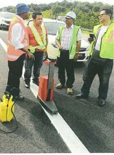 Client and Everclass engineers verifying road marking quality on site