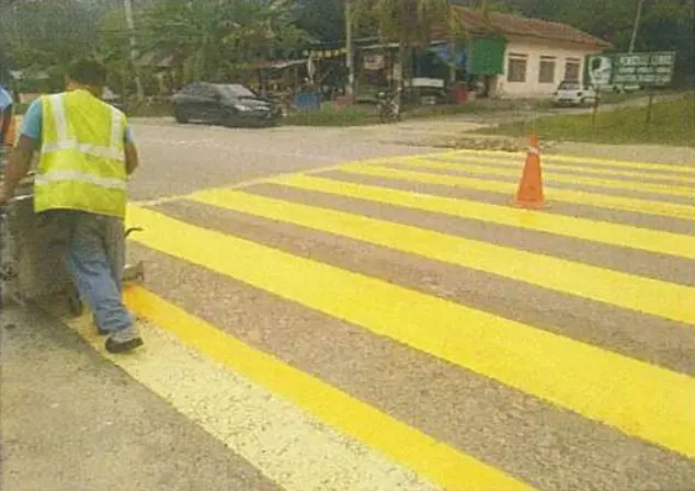 Yellow box junction marking at a pedestrian crossing